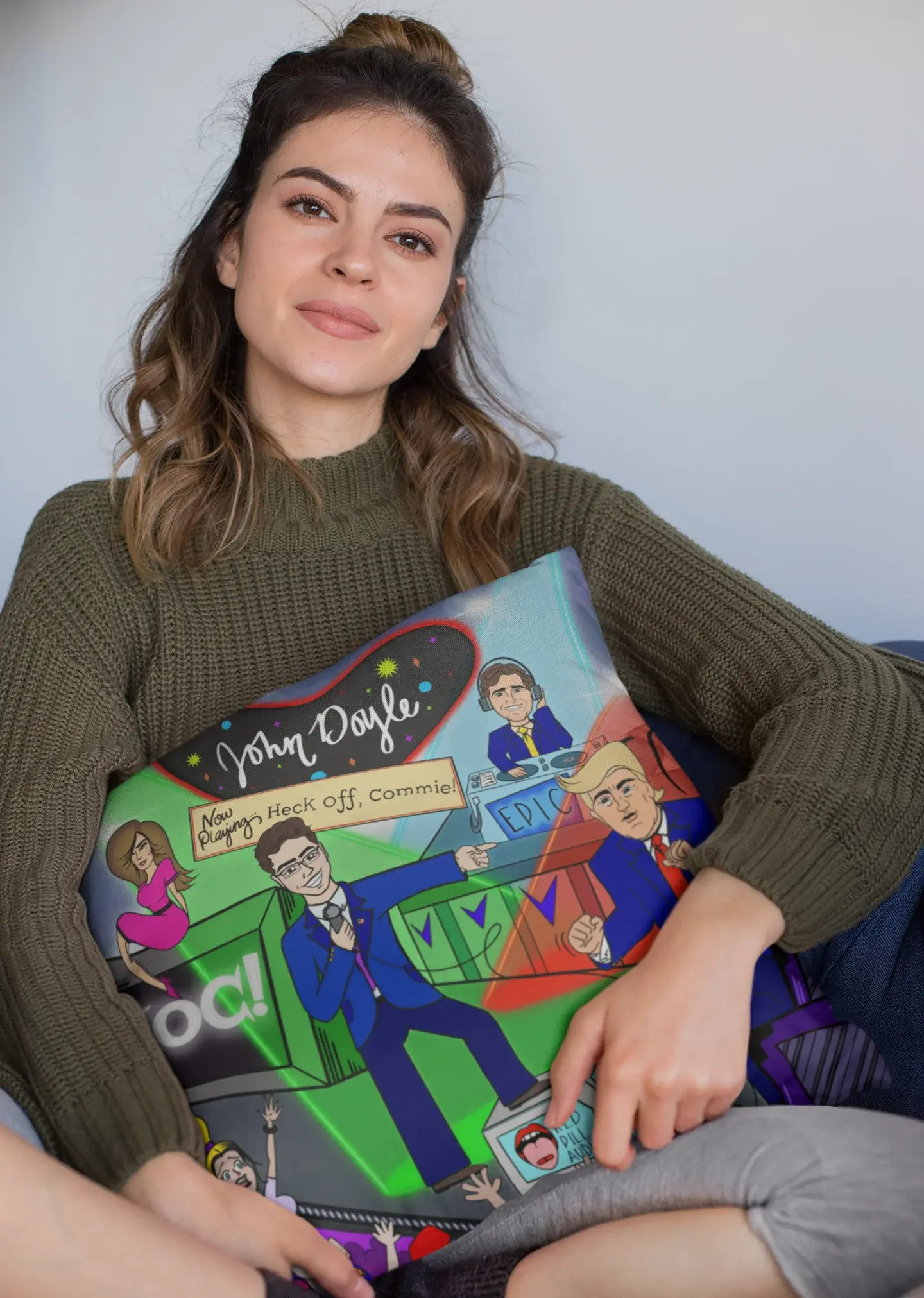mockup of a woman holding a square pillow while sitting 23577